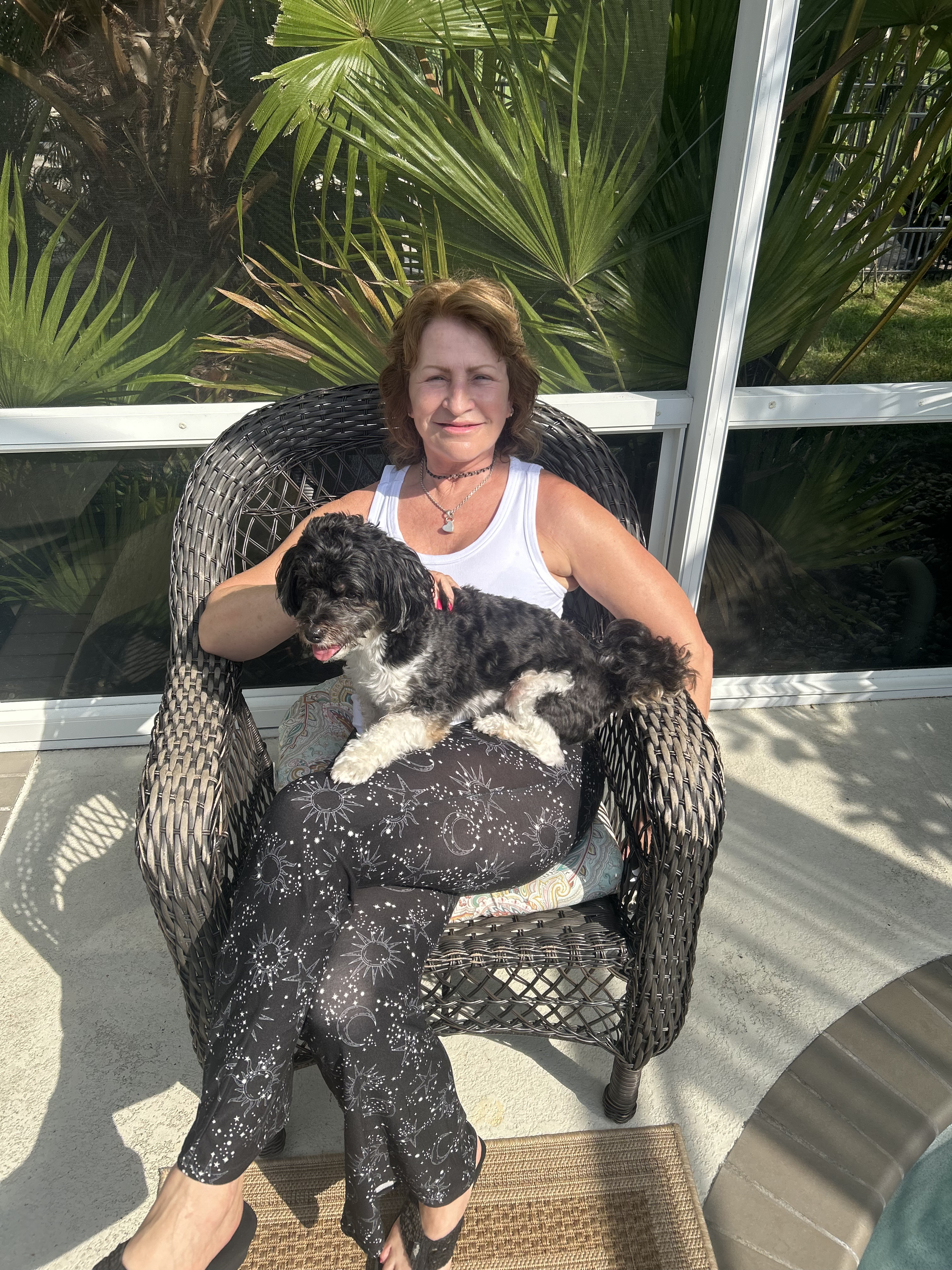 Shelly with her dog on the porch